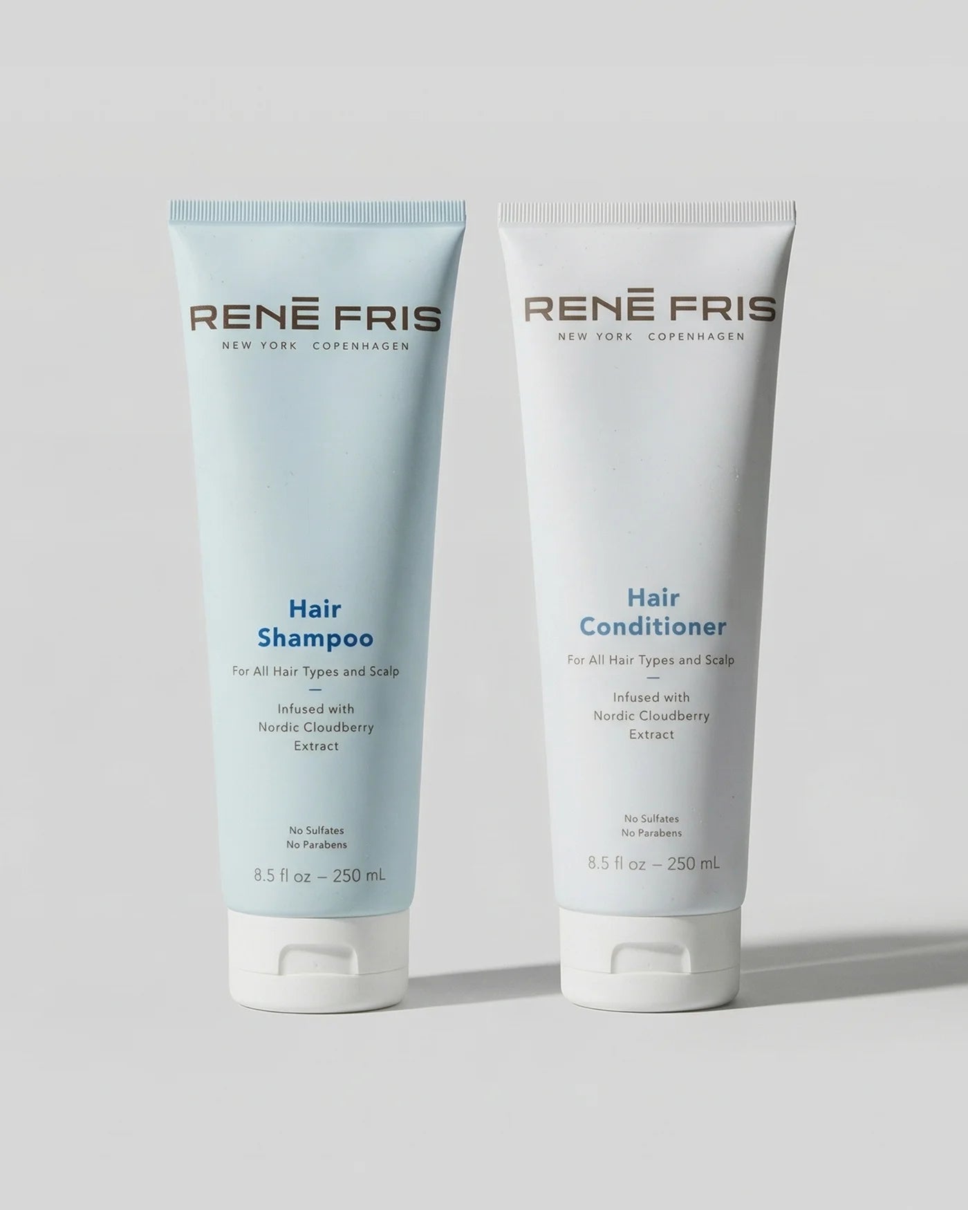 Two Rene Fris hair care products, Hair Shampoo and Hair Conditioner, on a light gray background.