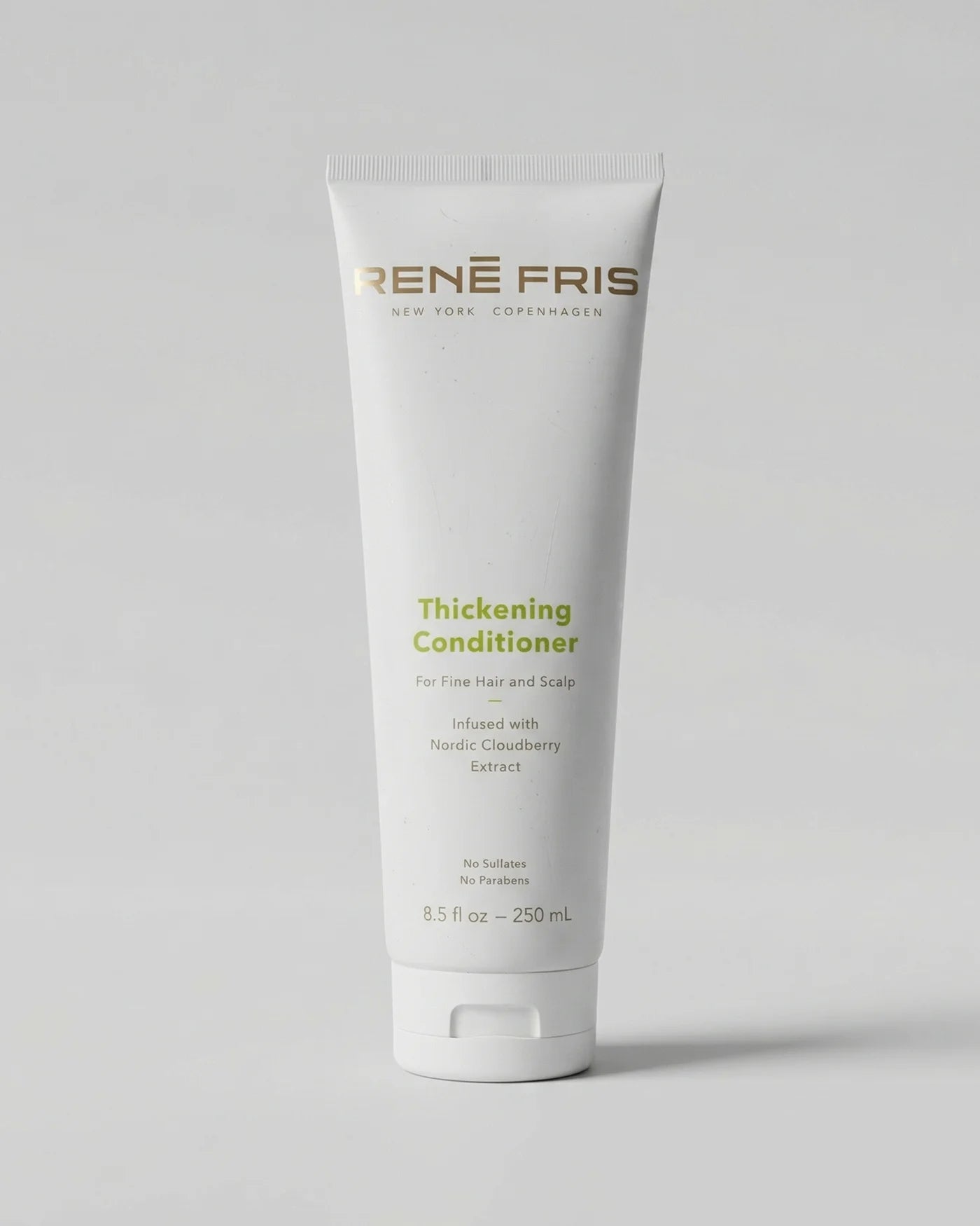 René Fris Thickening Conditioner tube on a light gray background