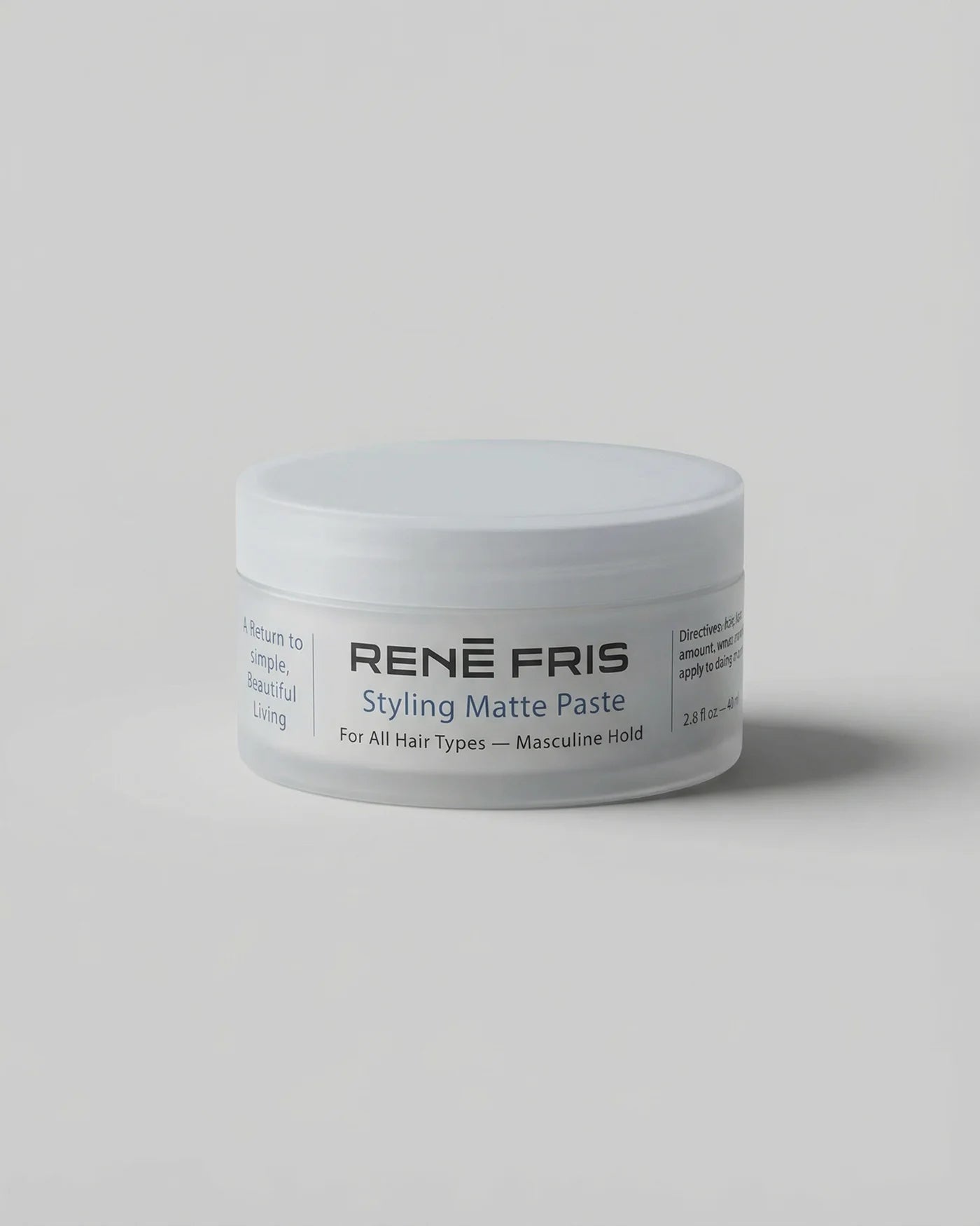 Jar of Rene Fris Styling Matte Paste on a light gray background
